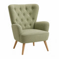 Poltrona in tessuto verde con gambe in legno